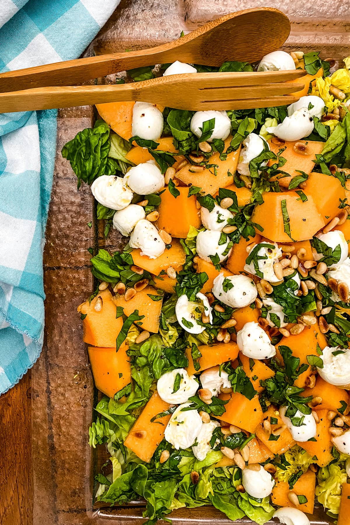 glass platter with cantaloupe, fresh mozzarella