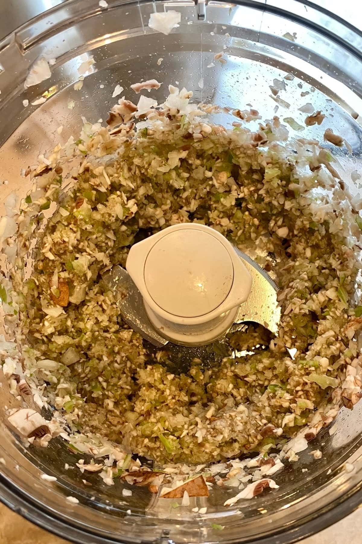 Finely chopped vegetables in a food processor.