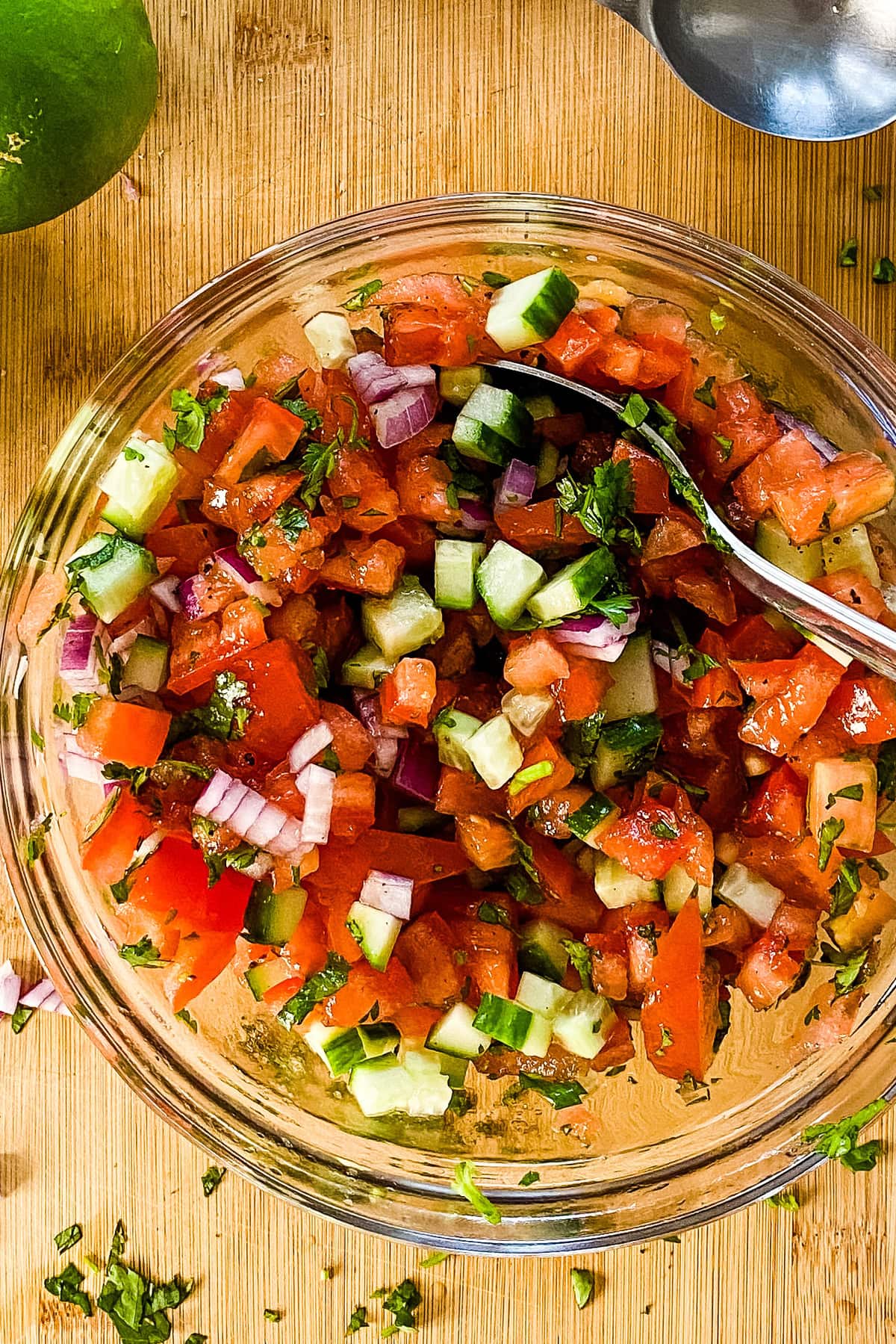 Tomatoes, cucumbers, red onion, and cilantro for a pico de gallo salsa.