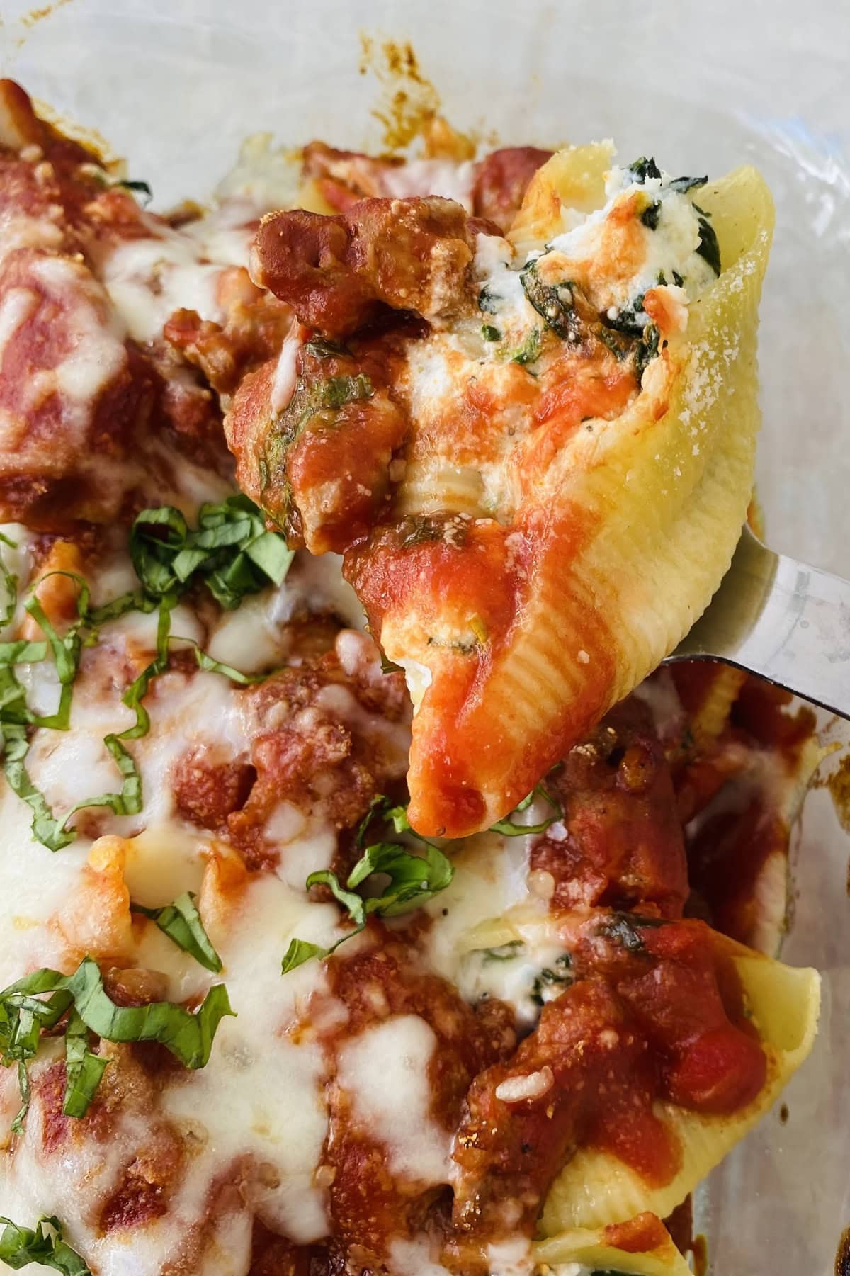 spoon with a stuffed pasta shell