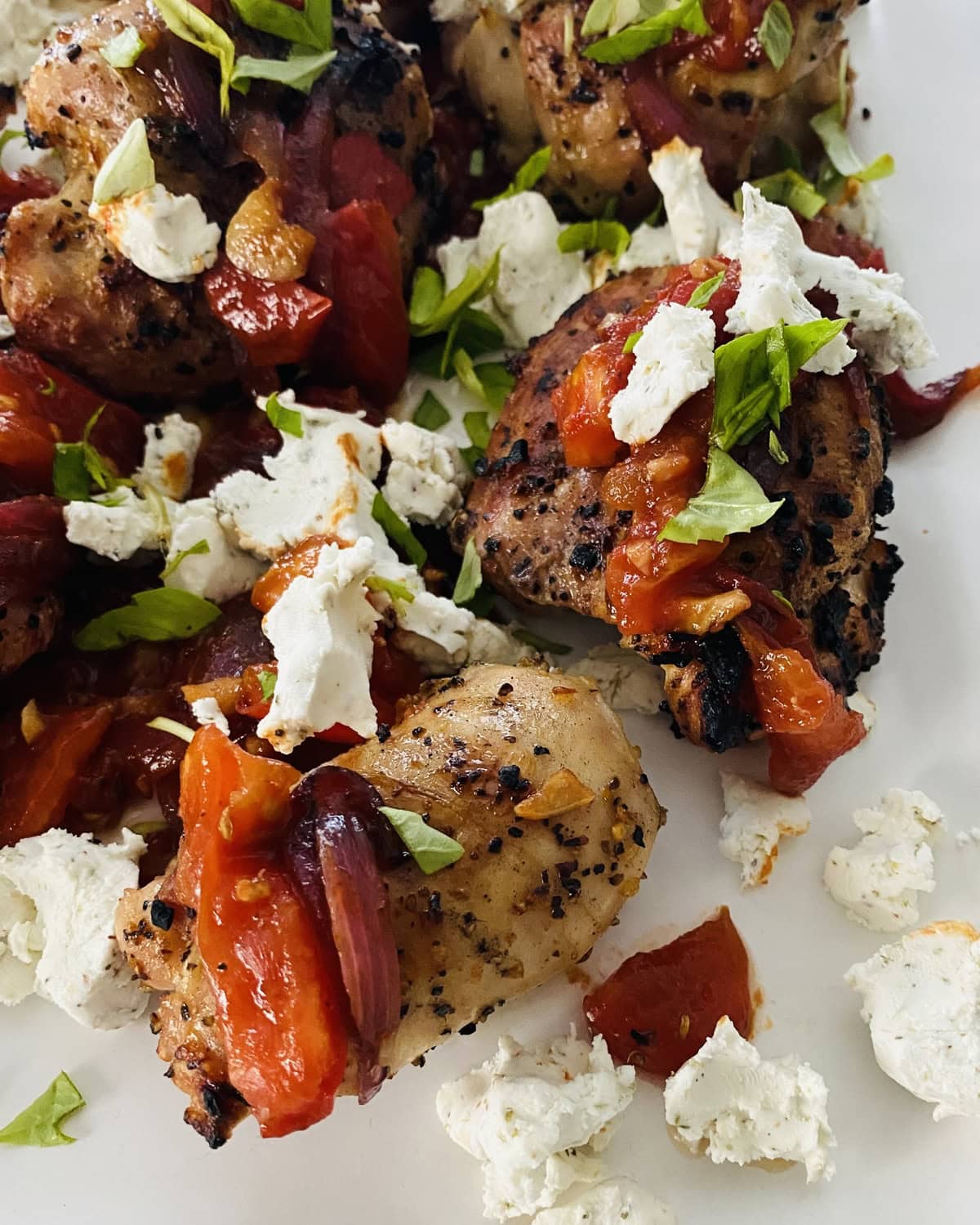 grilled chicken thighs with bruschetta and goat cheese