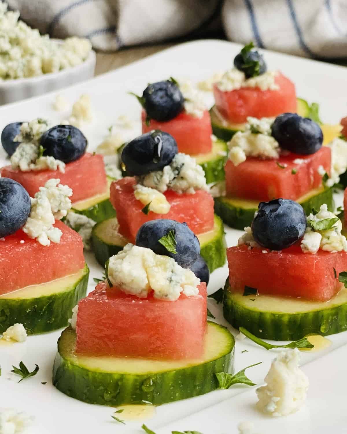 cucumber slices with watermelon blue cheese and blueberries