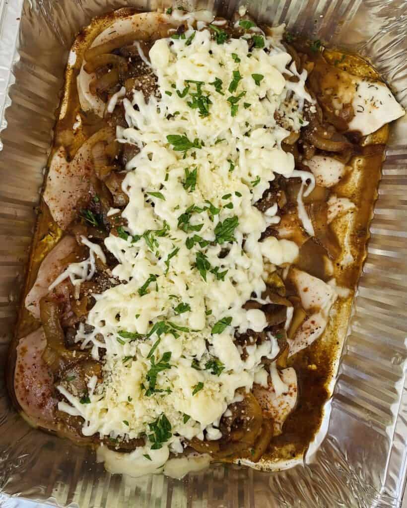 chicken topped with caramelized onions and mozzarella cheese