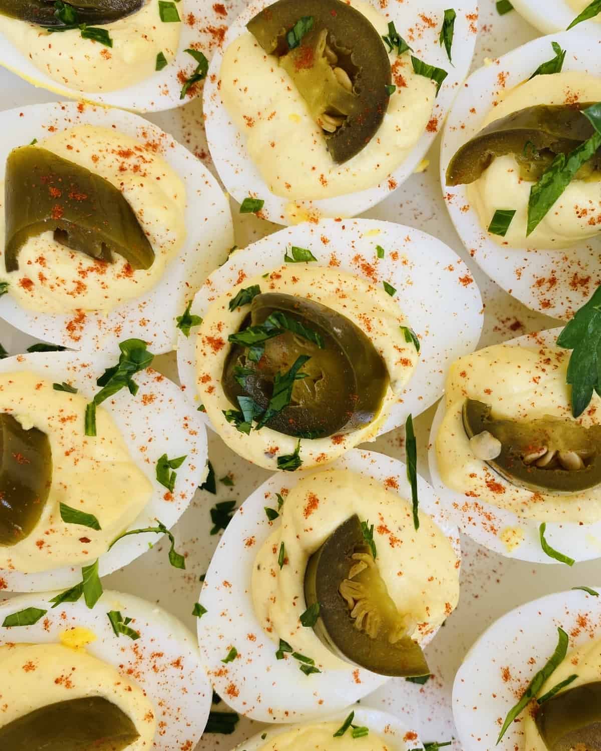 deviled eggs with jalapenos, smoked paprika and parsley