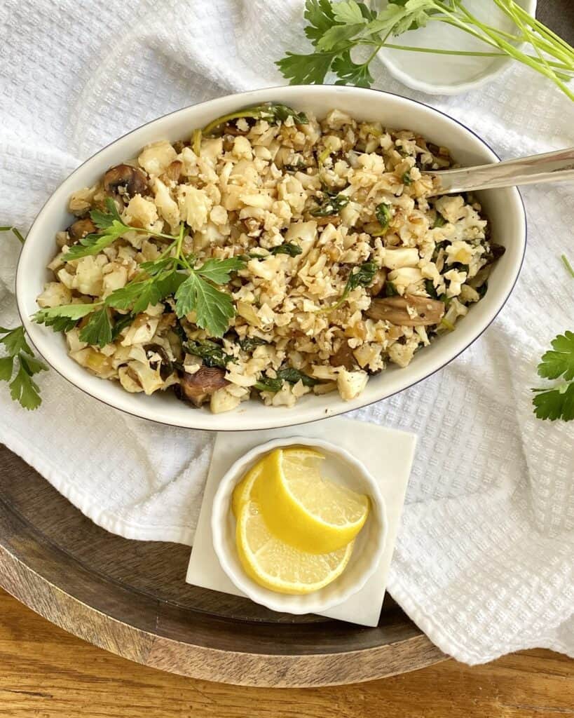 cauliflower that has been riced and sauteed with spinach and mushrooms