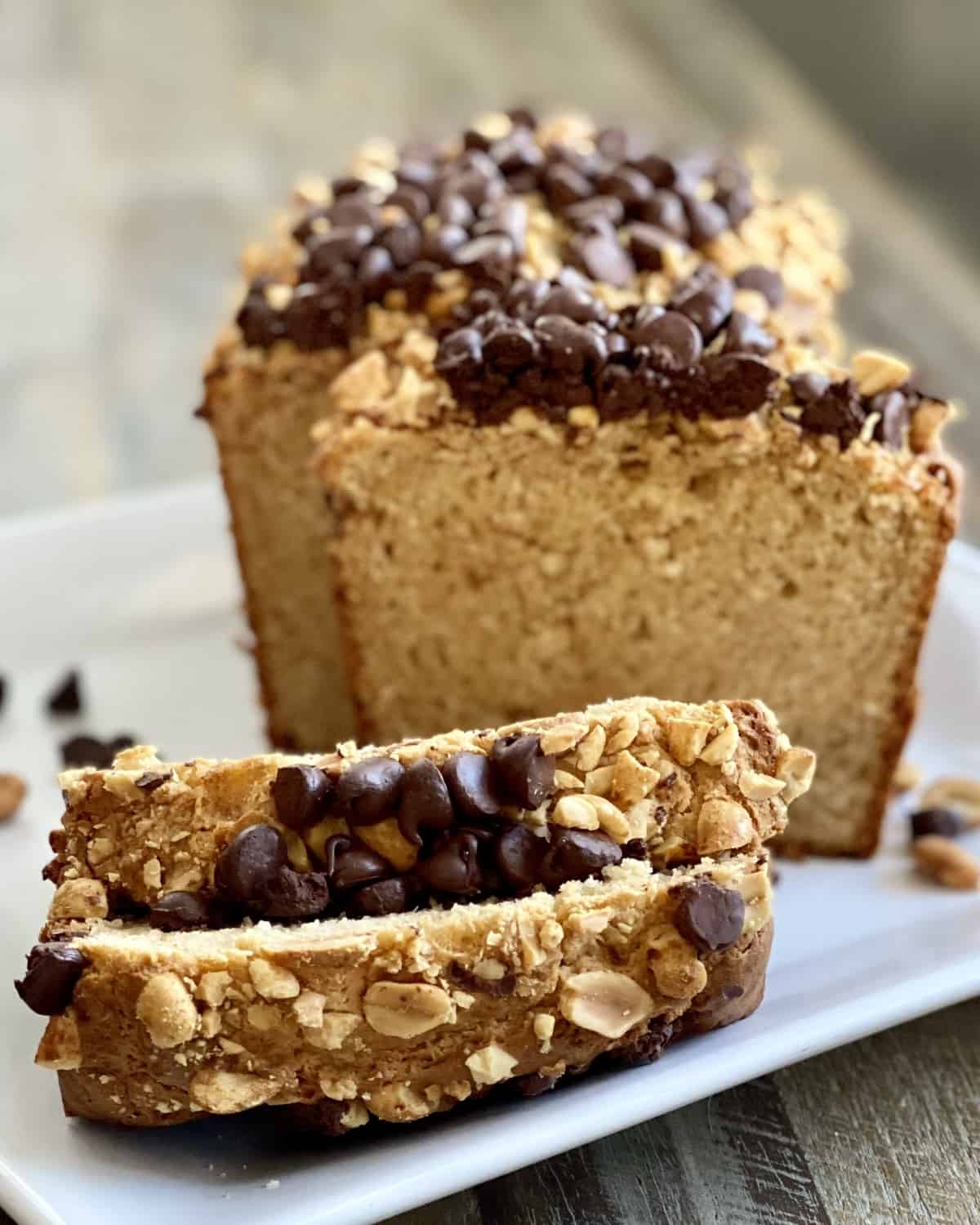 sliced peanut butter bread topped with peanuts and chocolate chips