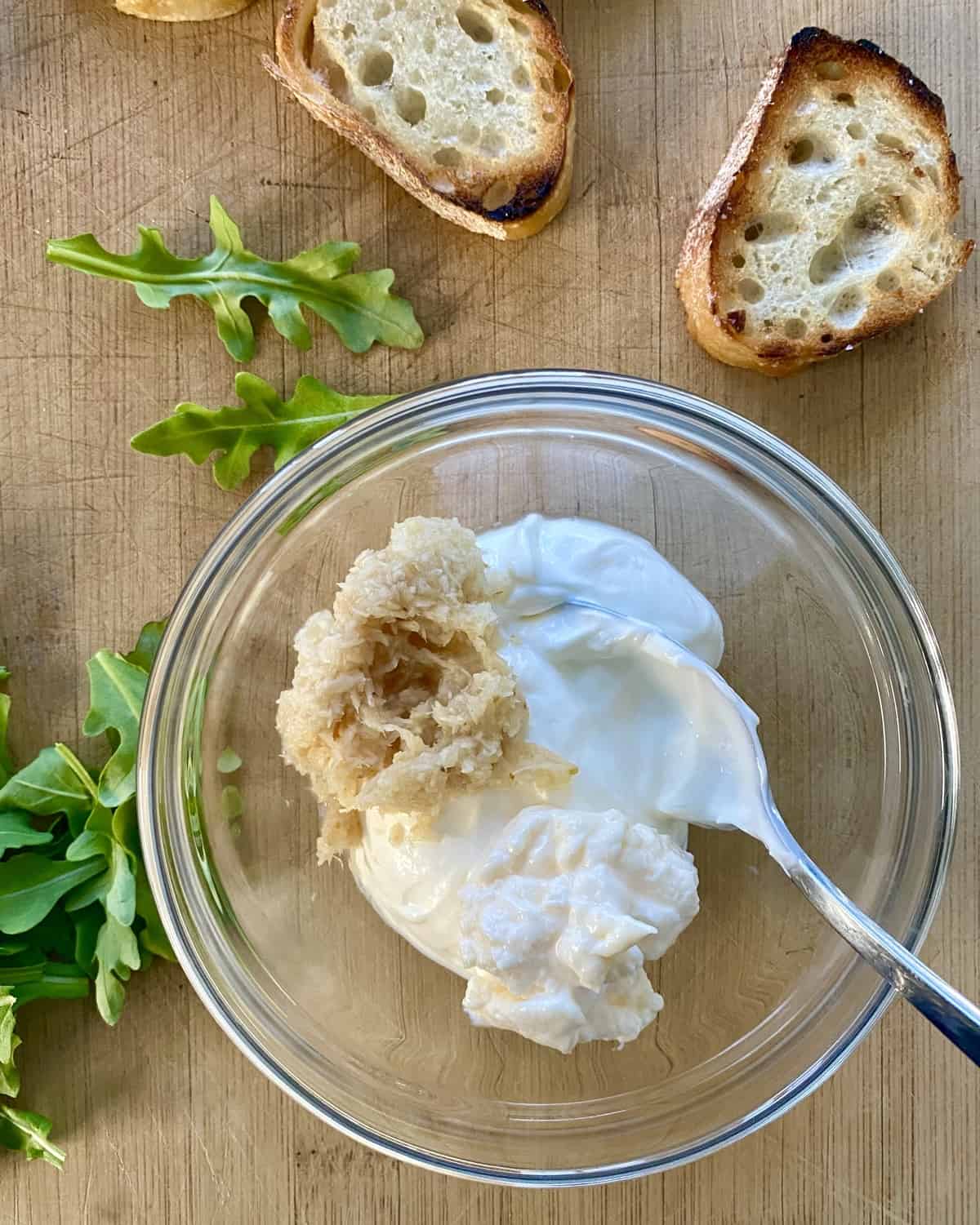 mixing sour cream, horseradish, and mayonnaise