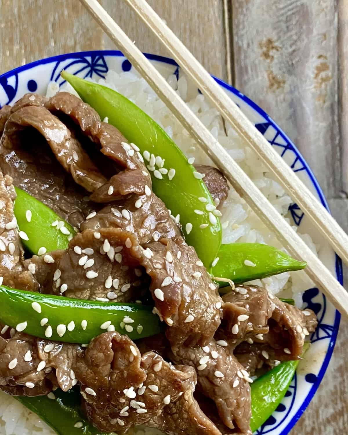 beef stir fry with snap peas over rice