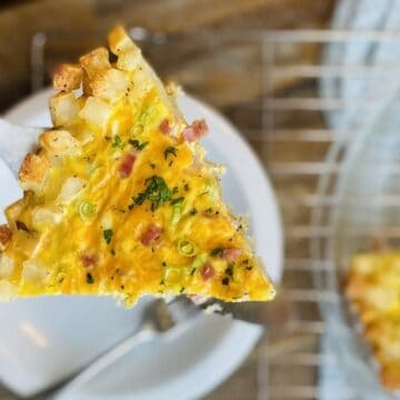 slice of quiche made with a hash brown crust
