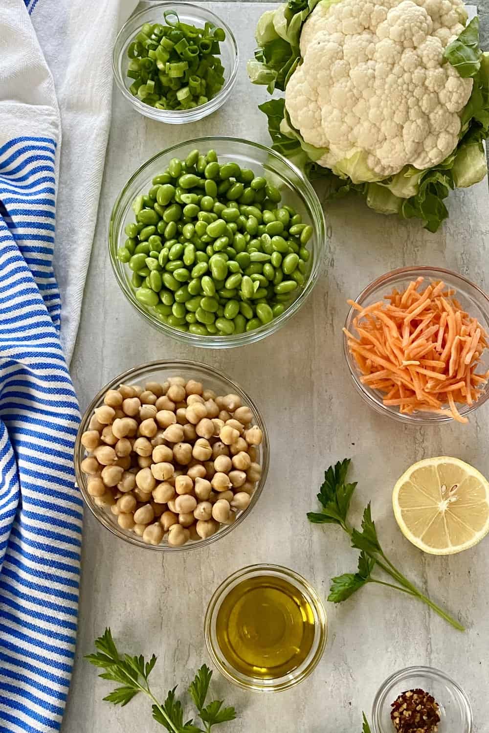 cauliflower, chickpeas, edamame, lemon, carrots for salad