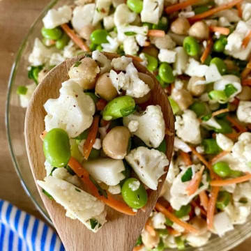 wooden spoon with cauliflower salad