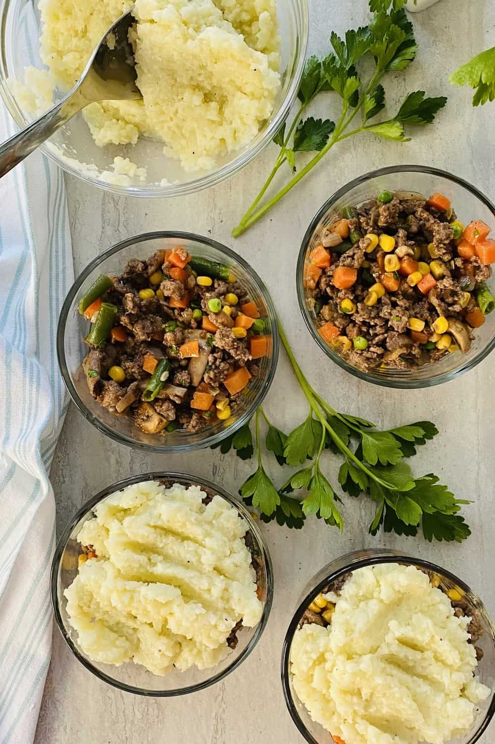 4 individual servings of turkey shepherds pie with cauliflower.