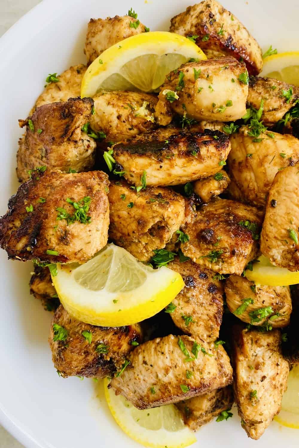 sauteed lemon herb chicken with lemon slices.