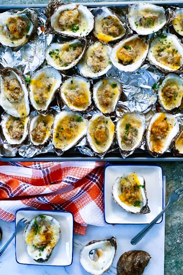 Baked oysters with cheddar and parmesan and creole seasoning.
