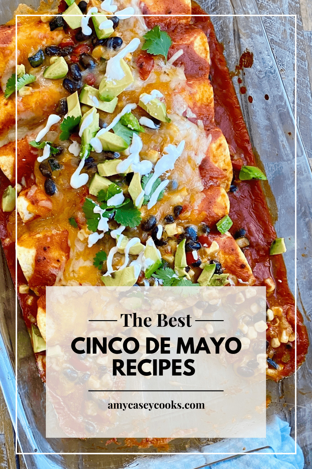 Veggies and bean enchiladas in a baking dish.