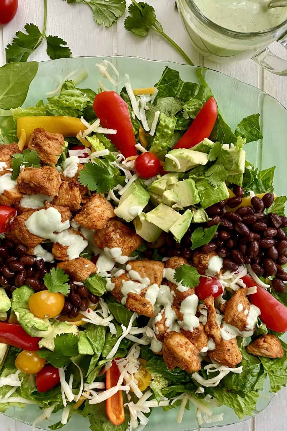 A southwest chicken salad with avocados and beans.