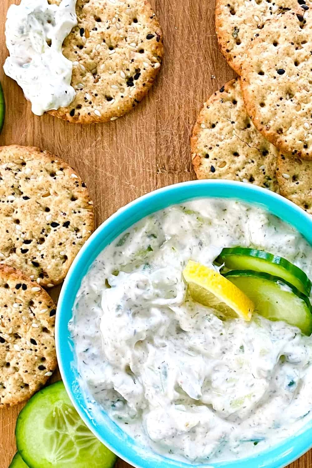 tzatziki sauce with crackers and cucumbers