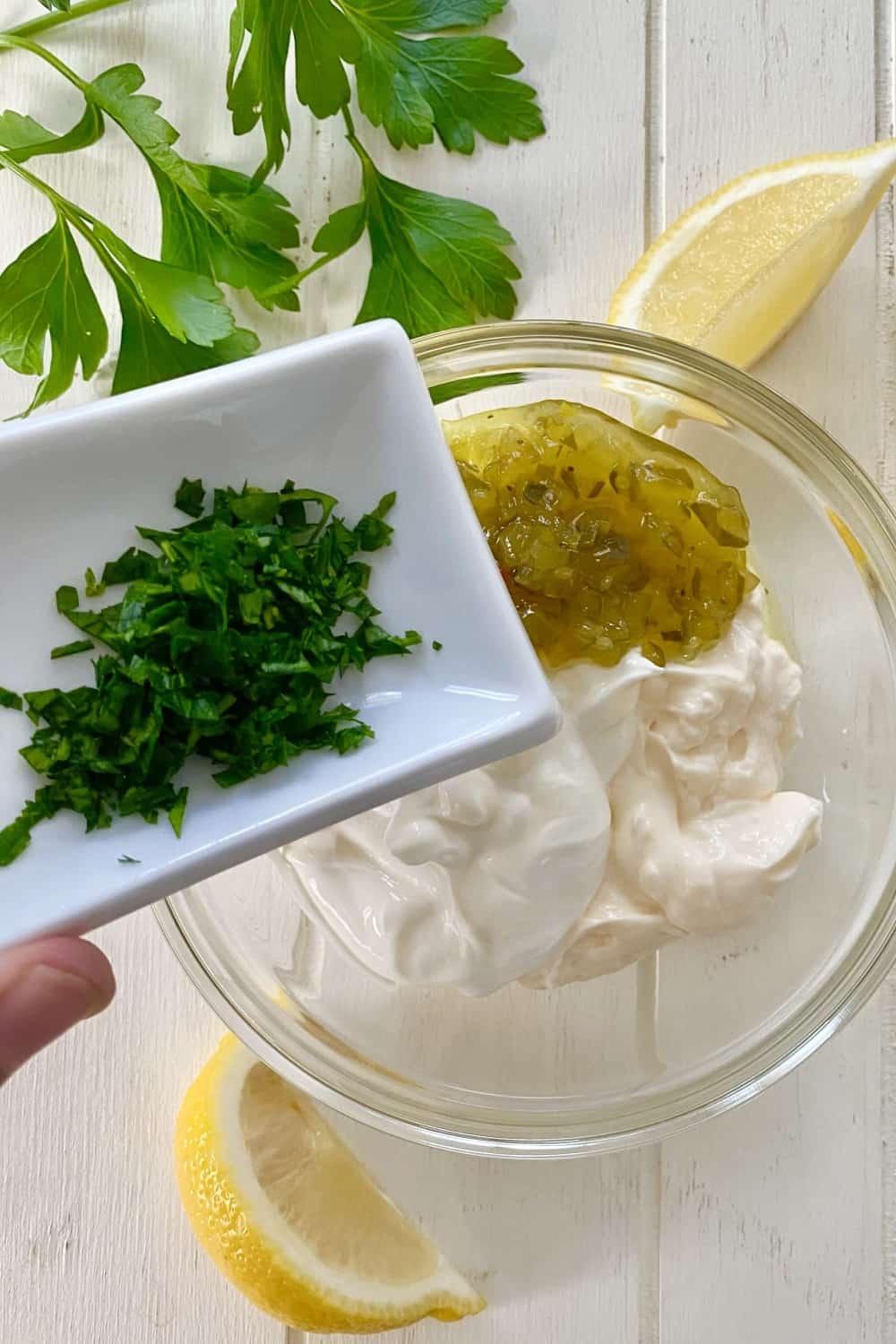 Sour cream, mayo, sweet pickle relish, fresh parsley, lemon.