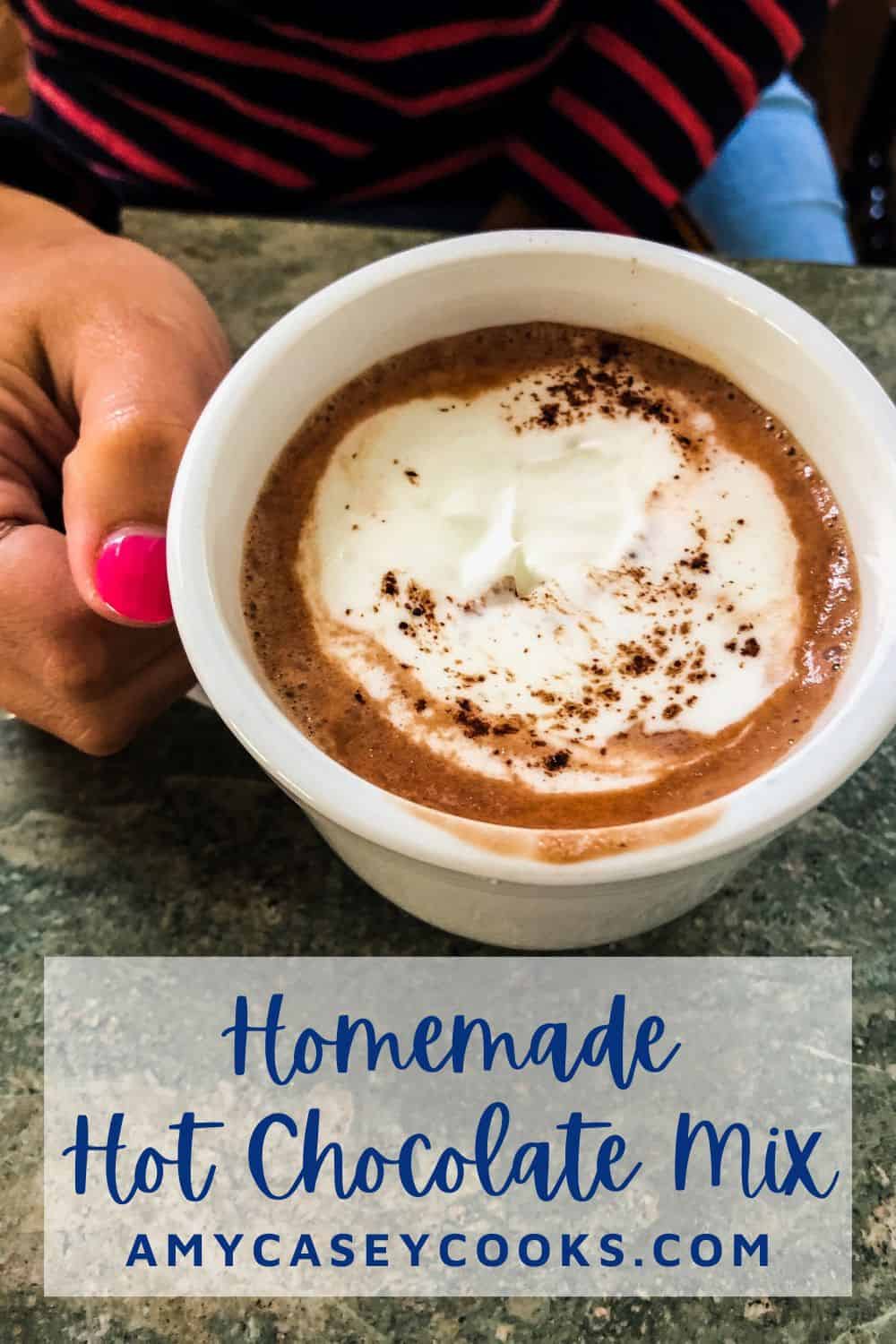 pretty girl holding a mug of hot chocolate