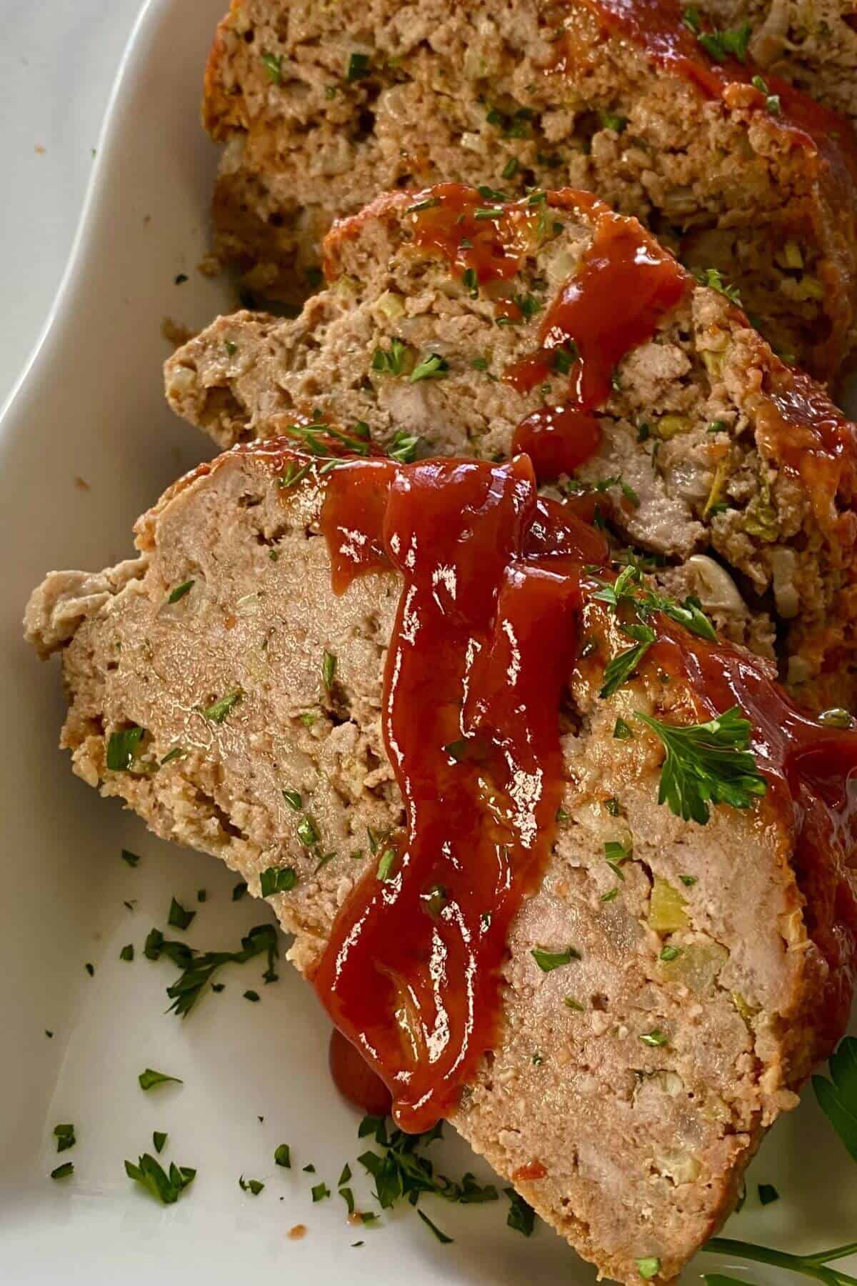 A comfort food meatloaf topped with ketchup.