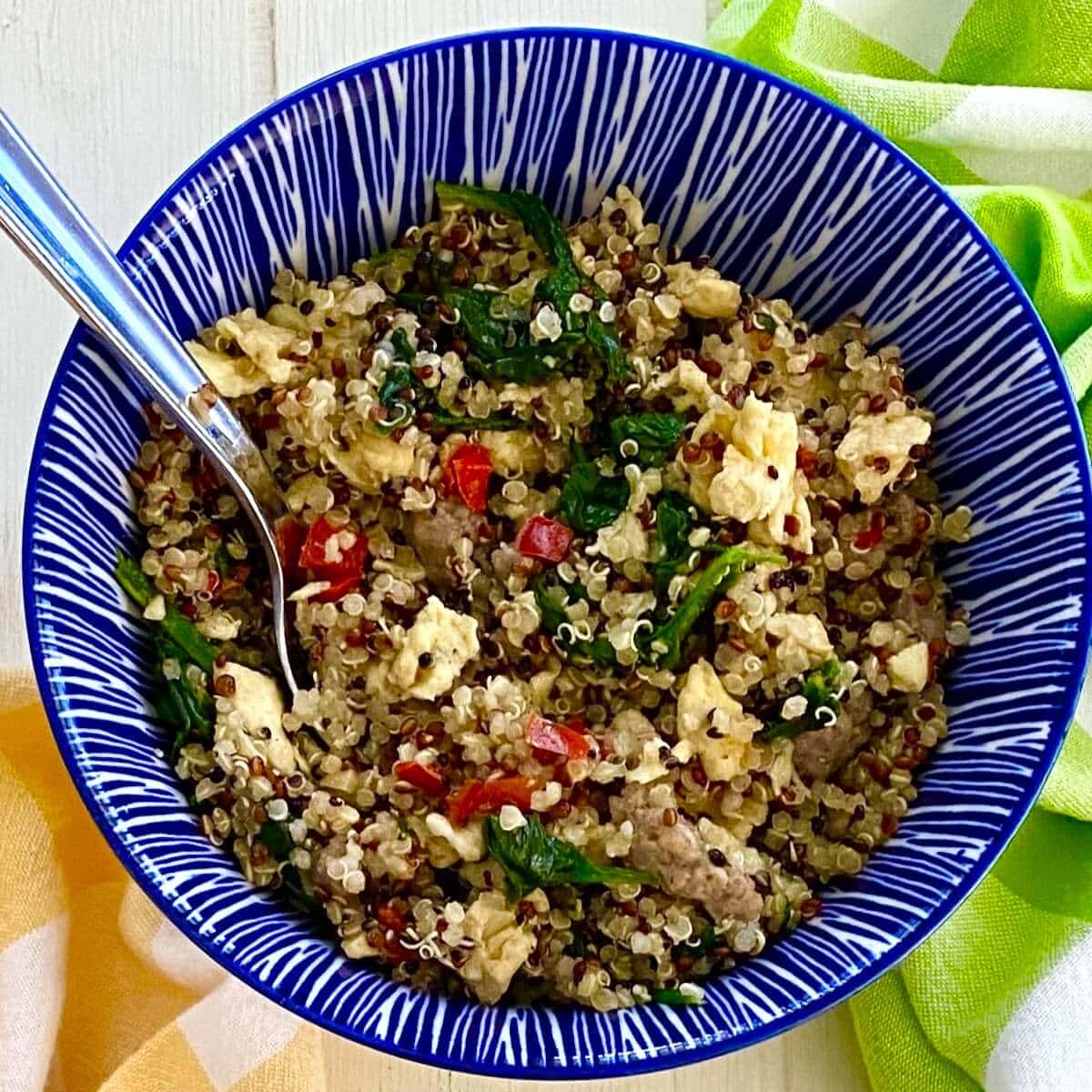 Savory Quinoa Breakfast Bowl with Egg, Sausage and Spinach