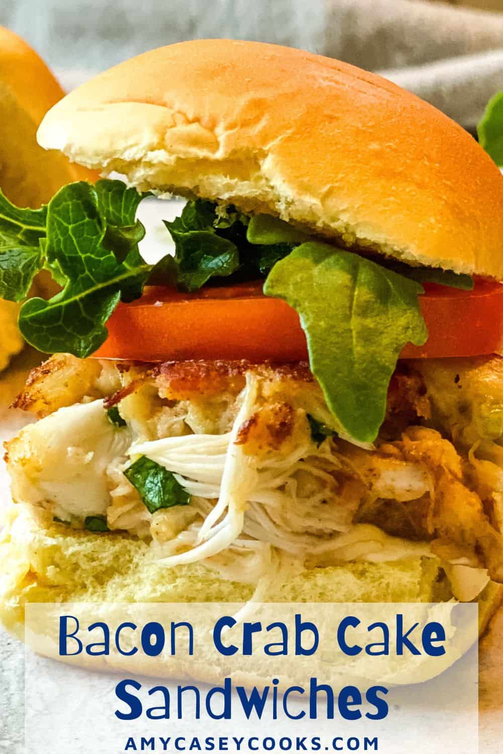 crab cake sandwich with bacon, lettuce and tomato.