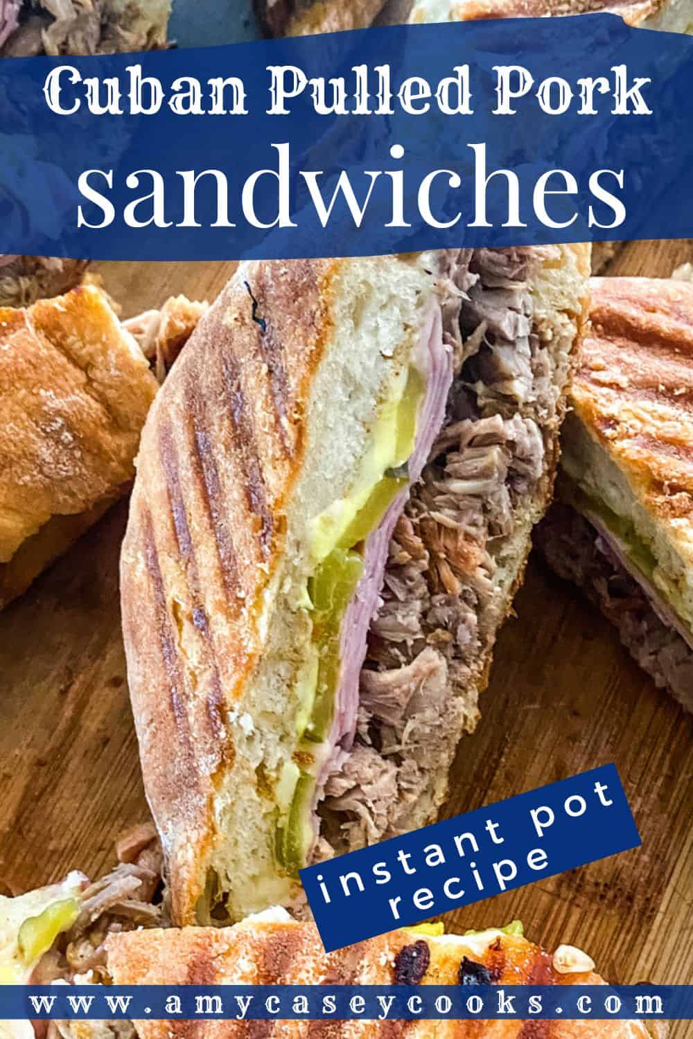 pressed Cuban sandwich with pulled pork and pickles.