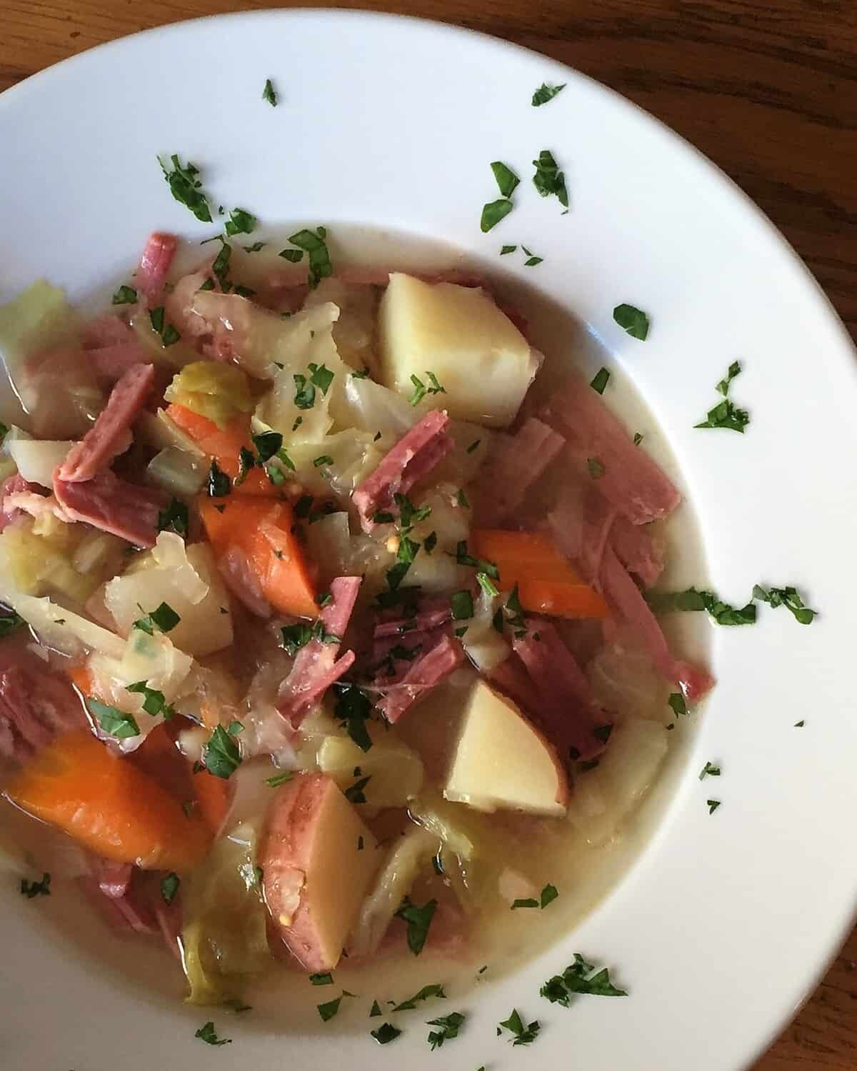hearty bowl of corned beef and cabbage soup.