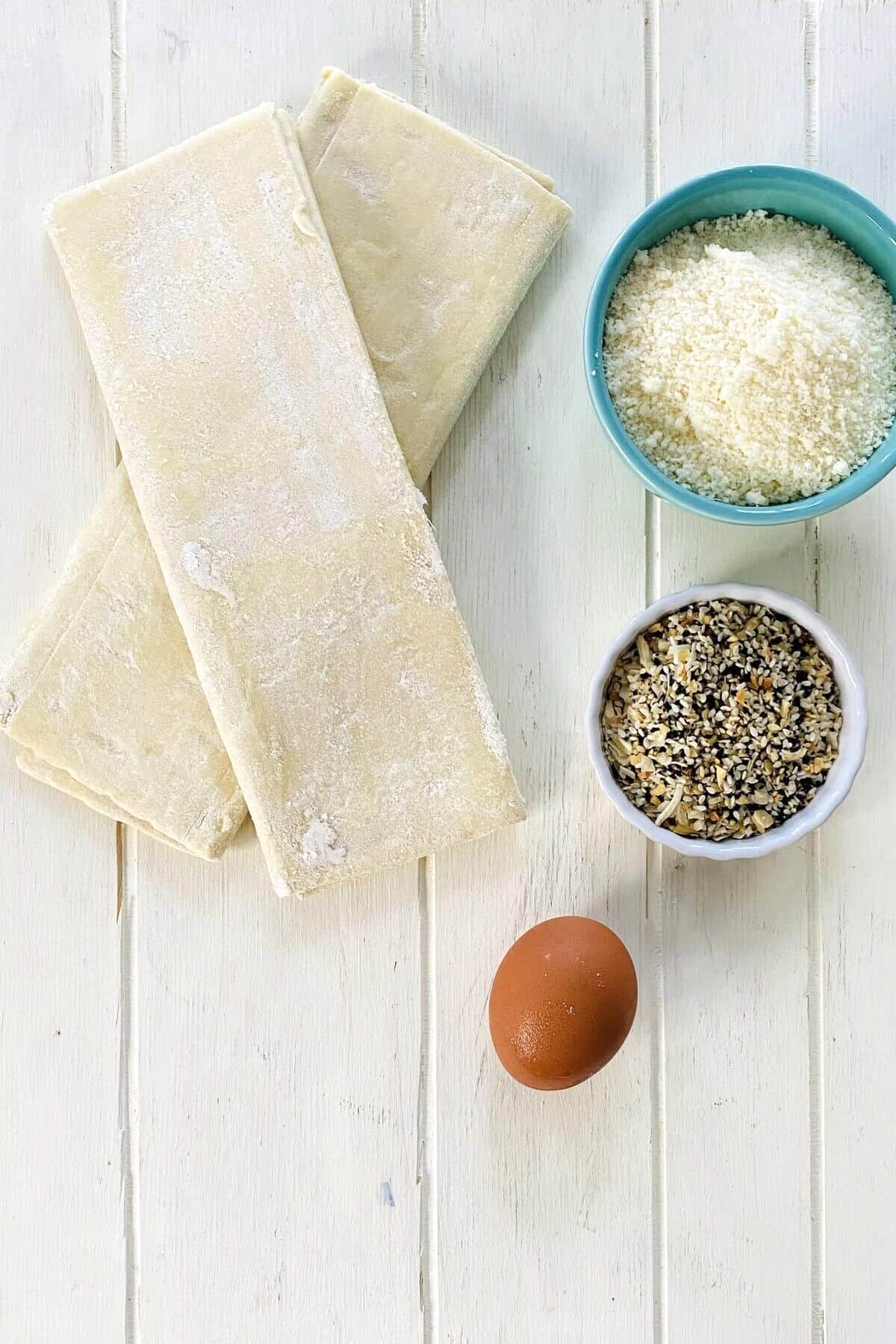 puff pastry sheets, everything bagel seasoning, Parmesan cheese, egg.