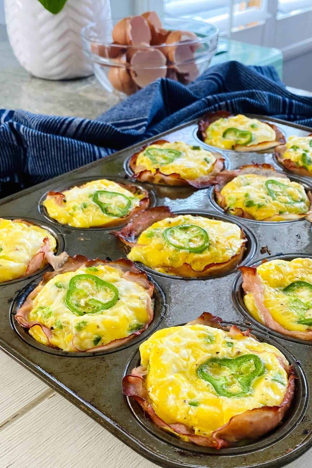 jalapeno egg cups in a muffin pan.