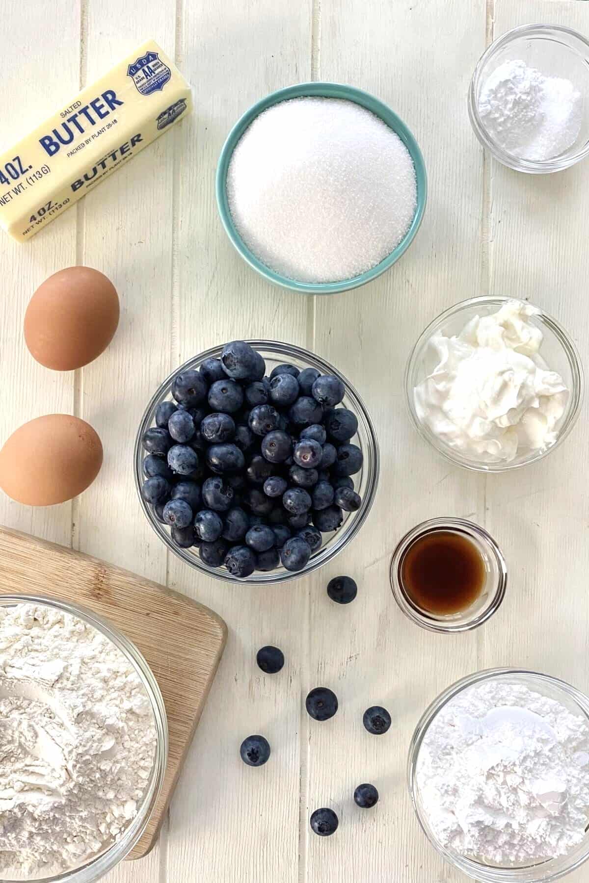 Butter, flour, blueberries, sugar, eggs, sour cream, and buttermilk.