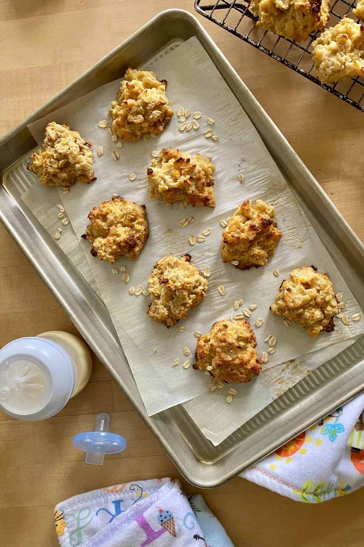 8 lactation cookies on a cookie sheet.