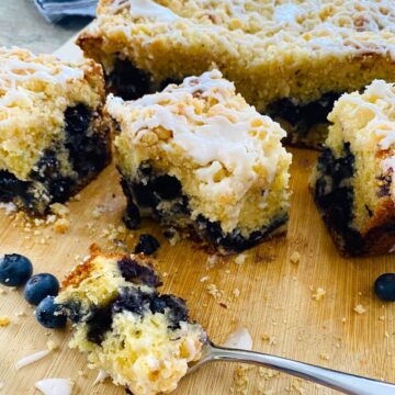 Slices of blueberry muffin cake and a fork.