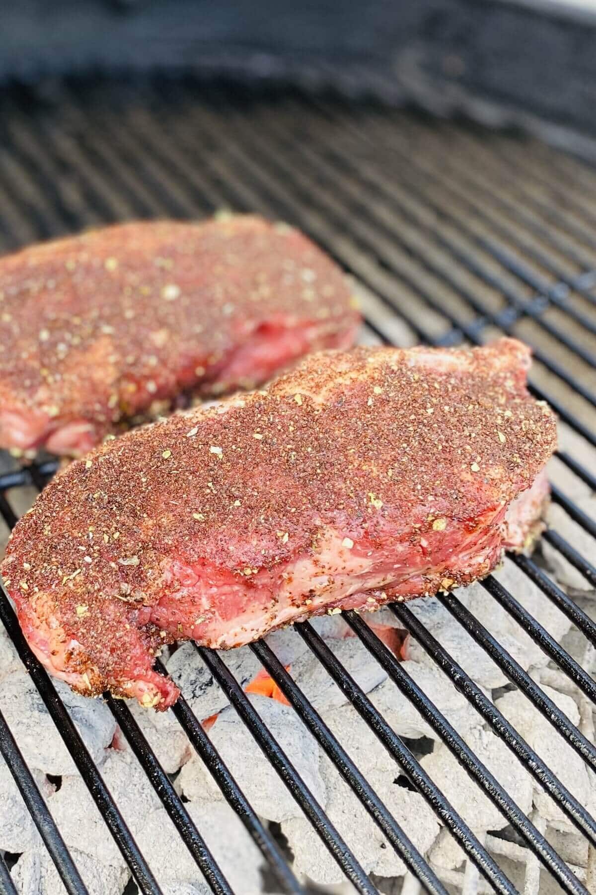 Coffee-rubbed steaks on grill.