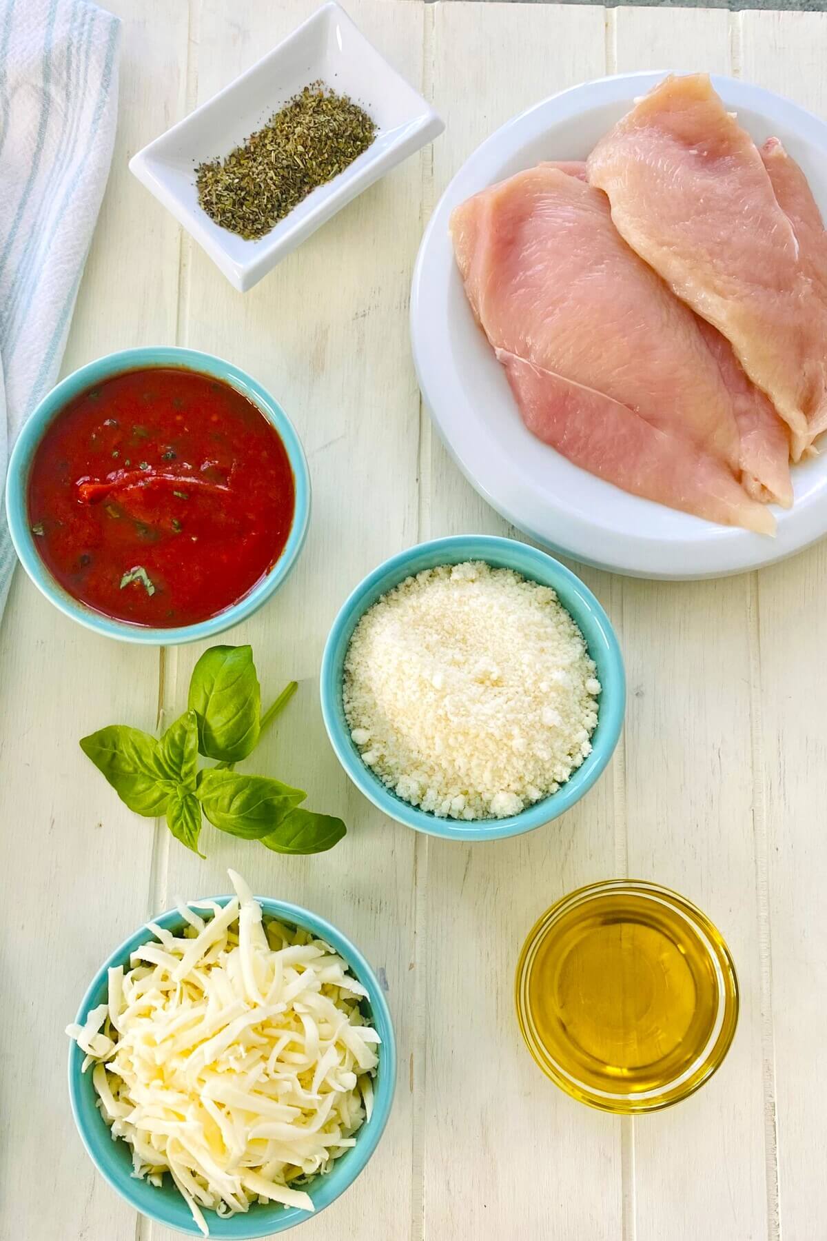 marinara sauce, basil, parmesan cheese, mozzarella cheese, chicken.