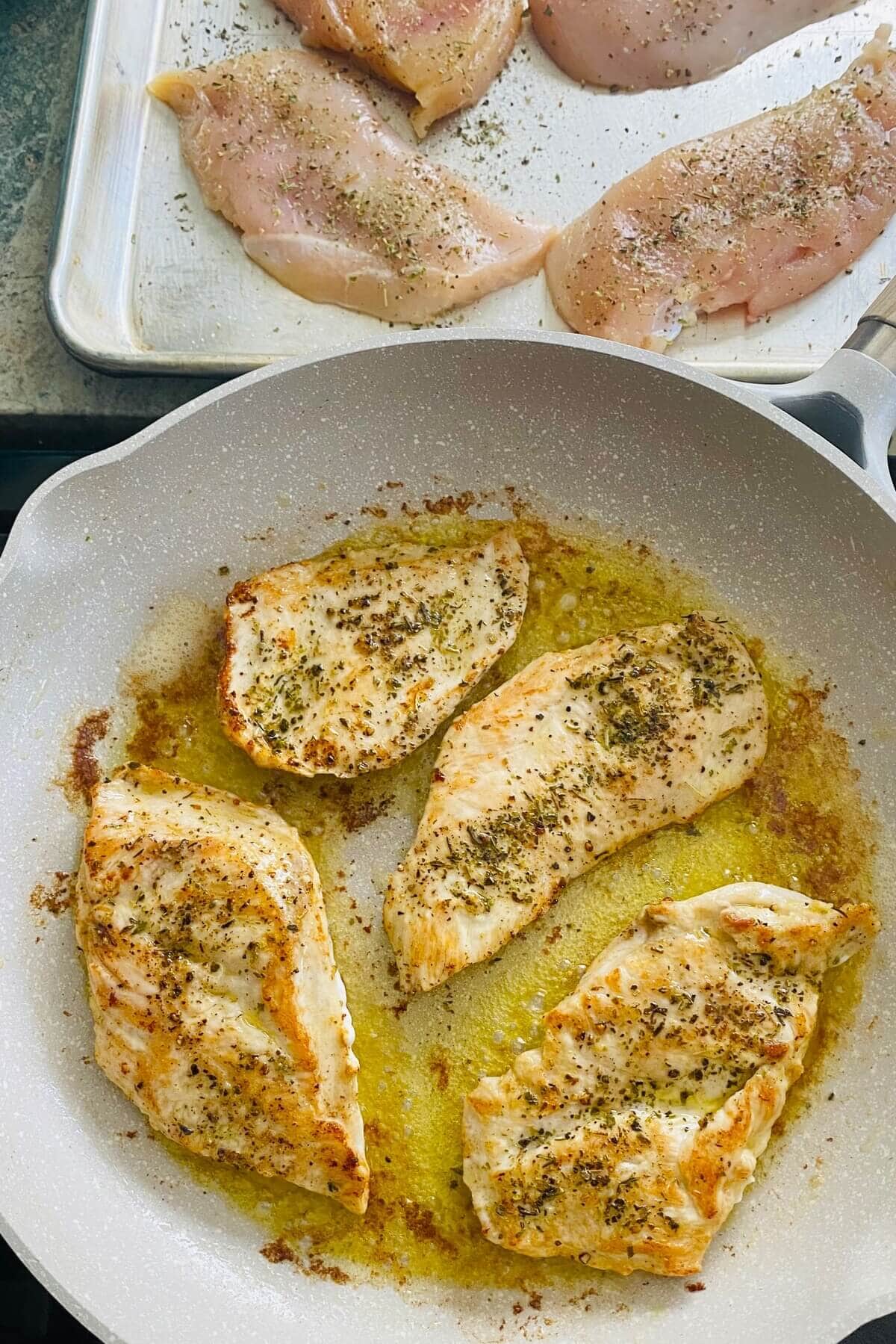 sauteing chicken for low carb chicken parmesan recipe.