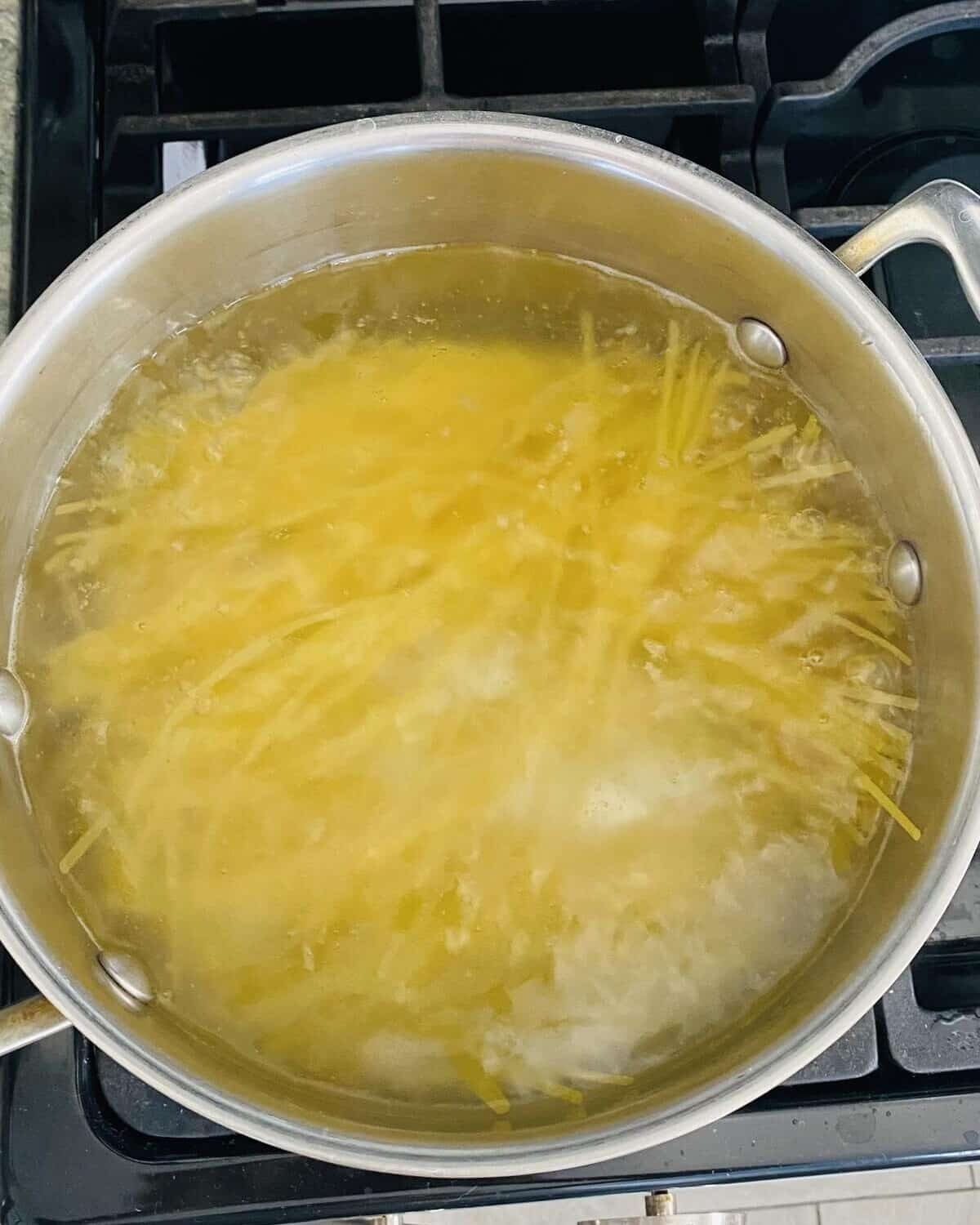 Boiling pasta.