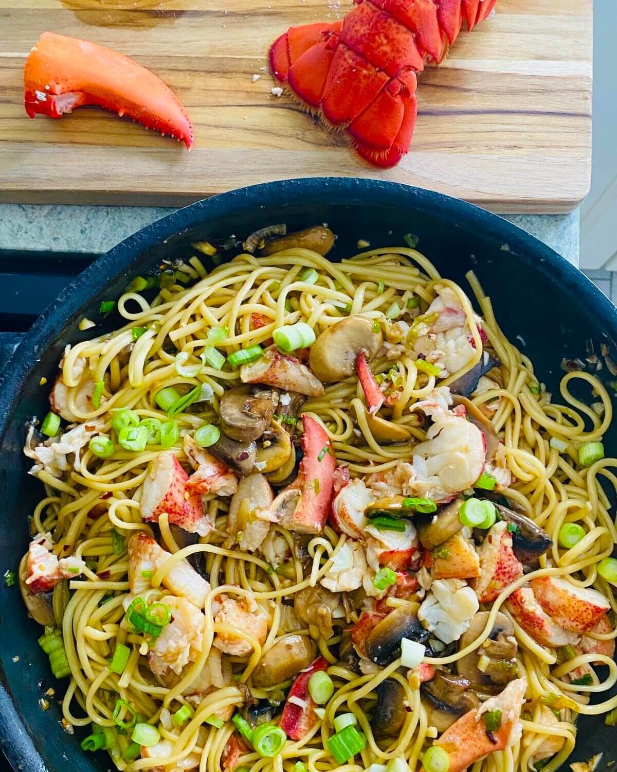 Lobster noodles on stovetop.