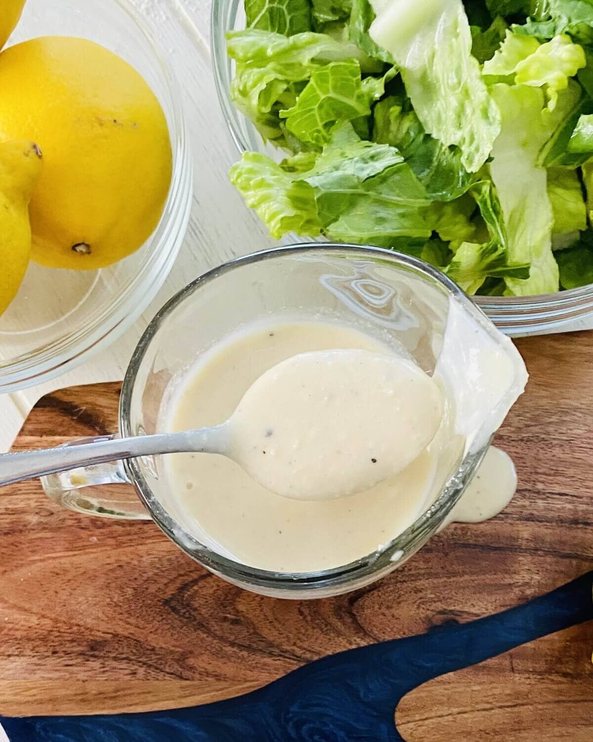 spoon of Caesar dressing.