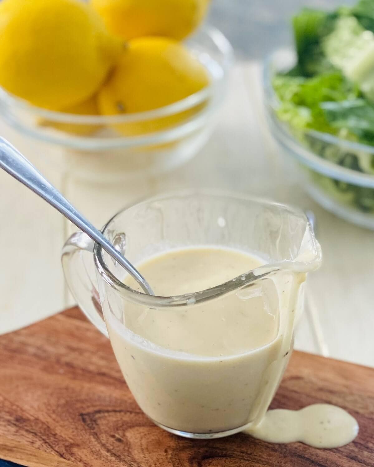 a pitcher of Caesar salad dressing without anchovies.