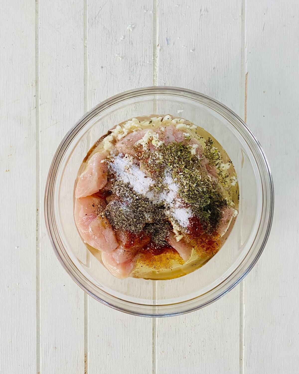 chicken with marinade ingredients.