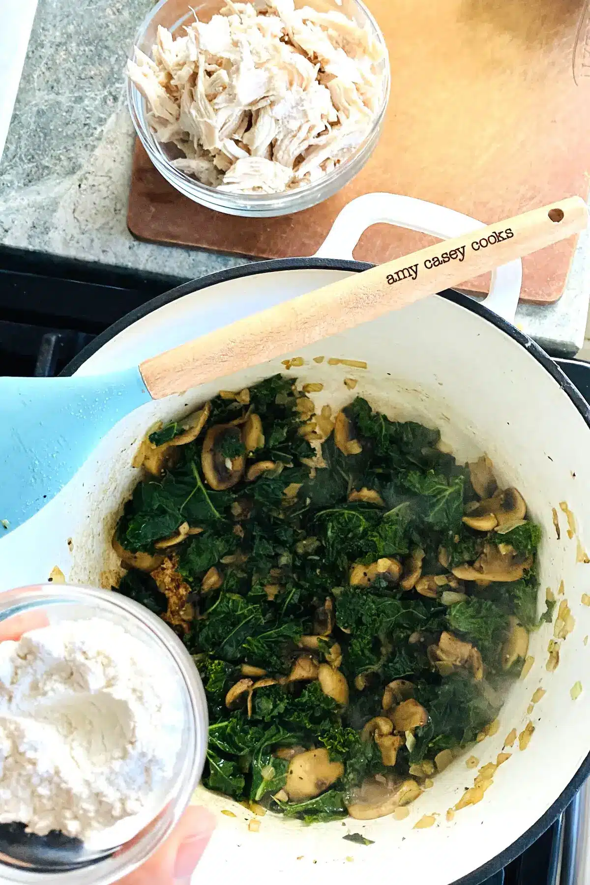 adding flour to sauteed vegetables.