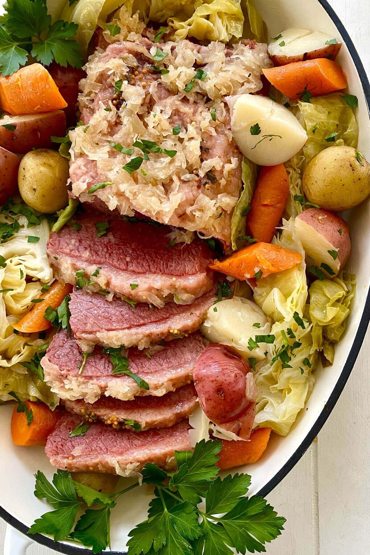A platter of instant pot corned beef and cabbage.