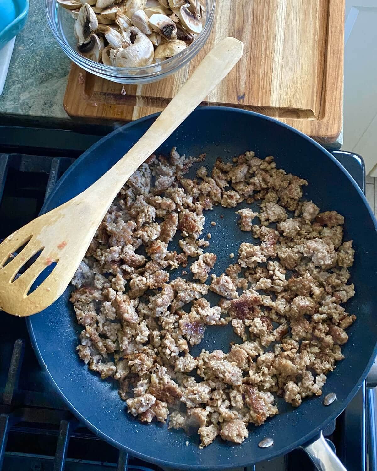 cooked sausage in a pan.