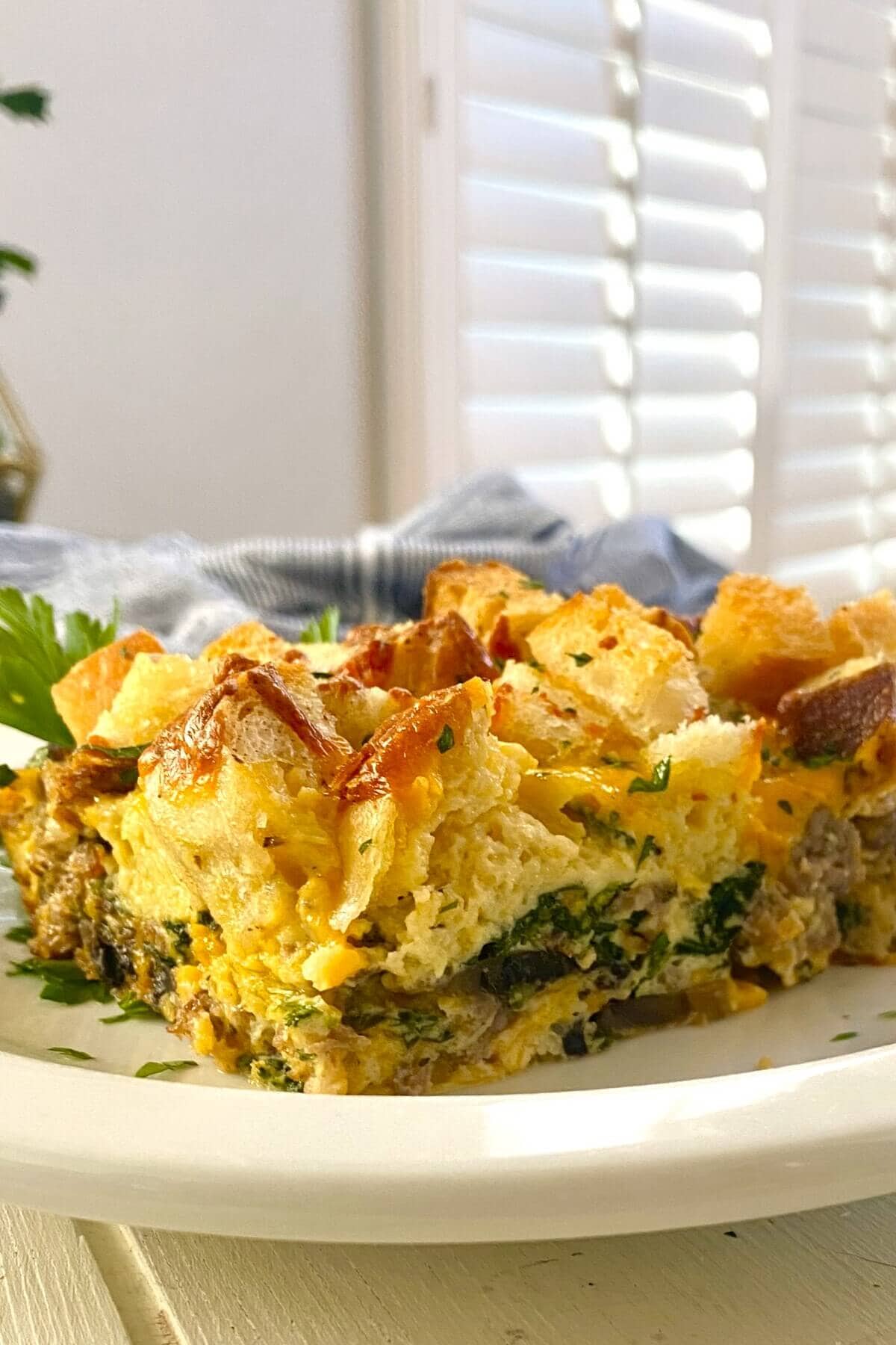 piece of breakfast casserole with sausage.