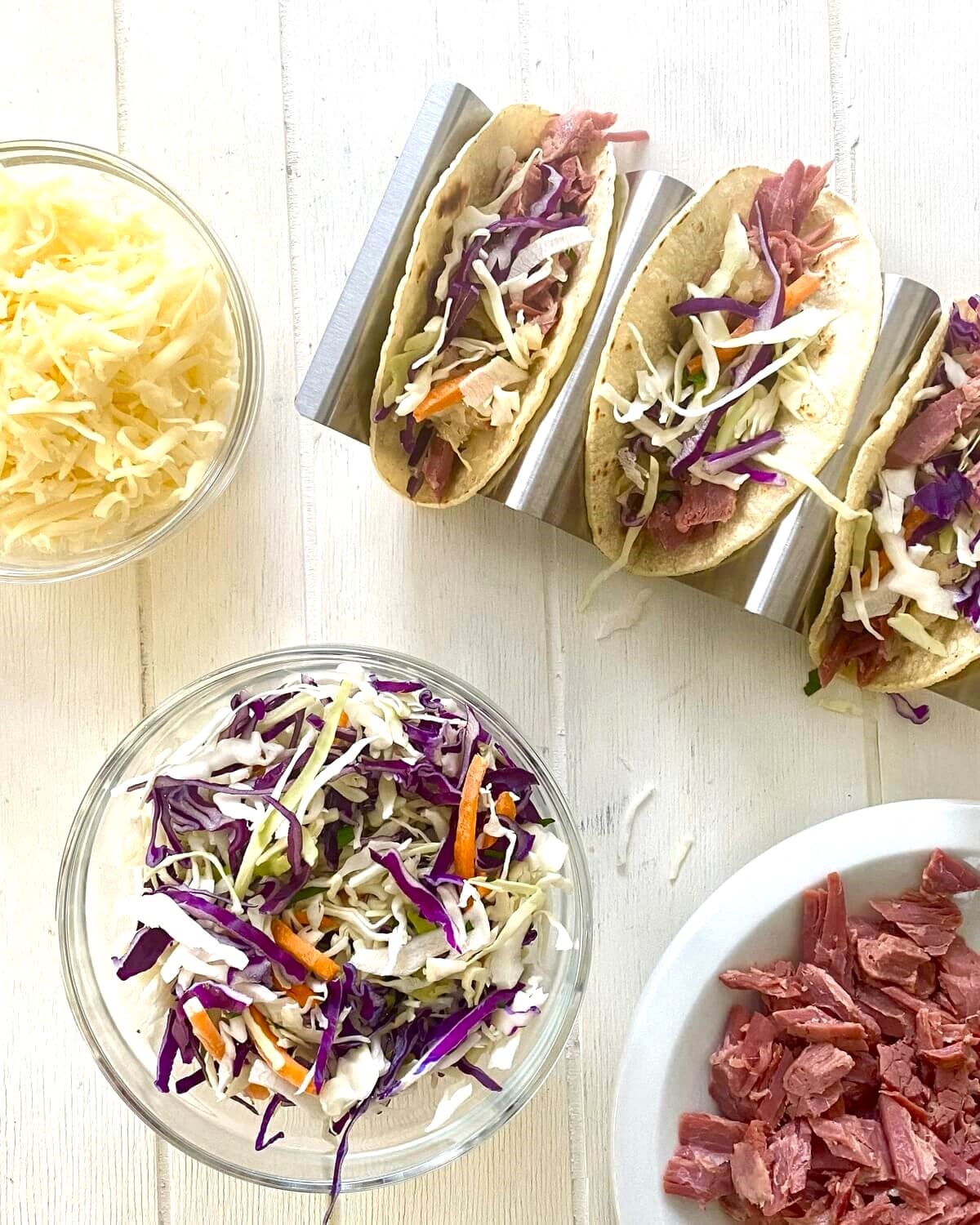 making Irish tacos with corned bee, Swiss cheese and cabbage.