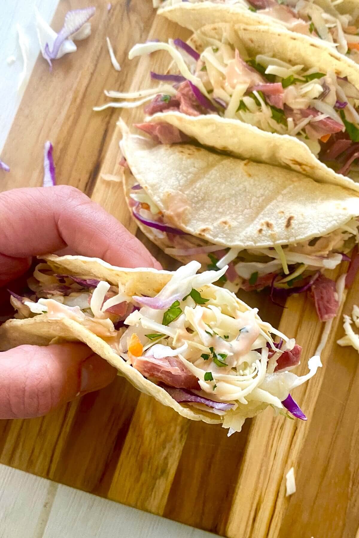 hand holding an Irish taco.