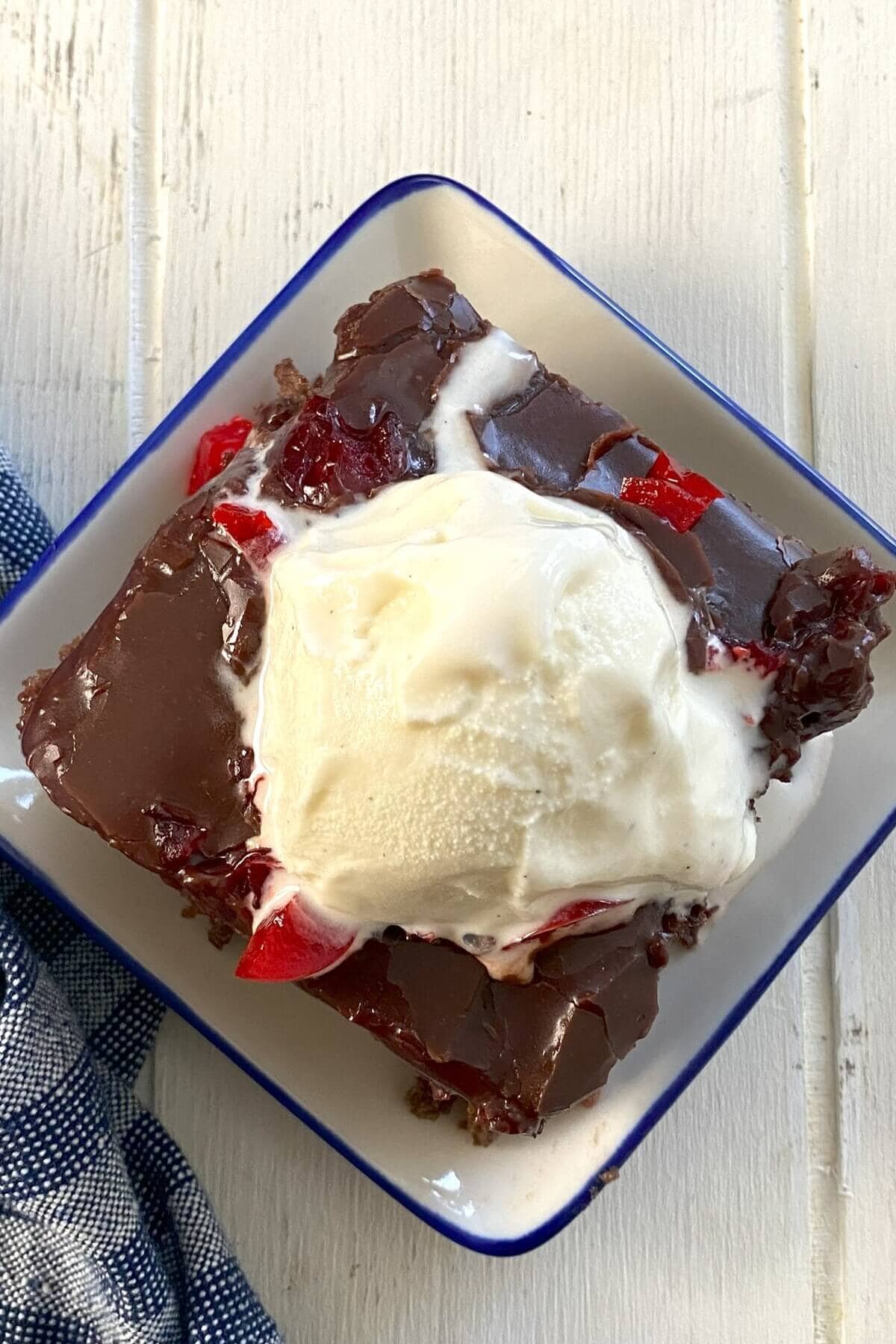 Melty ice cream on chocolate cake.