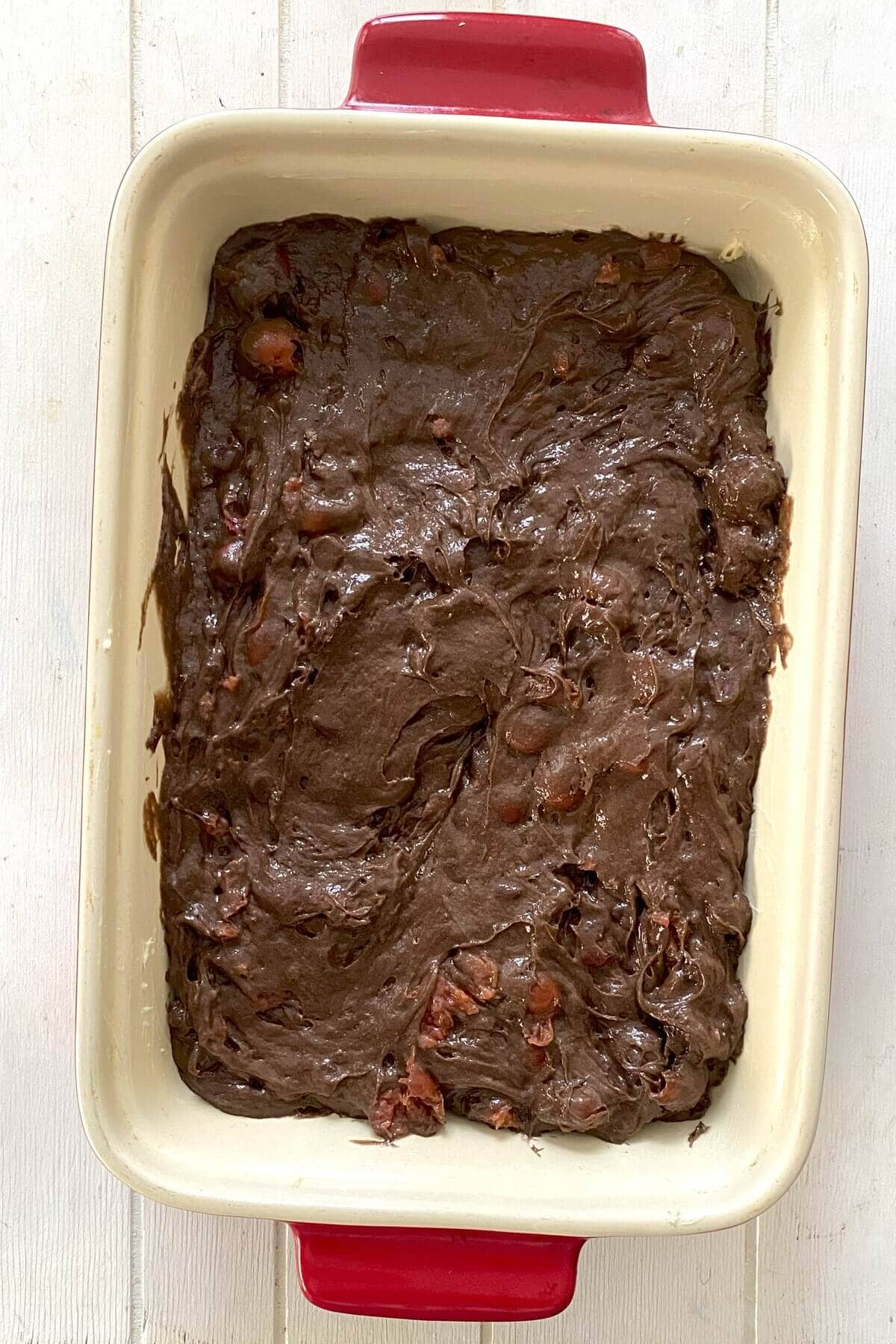 The cake batter in a baking pan.