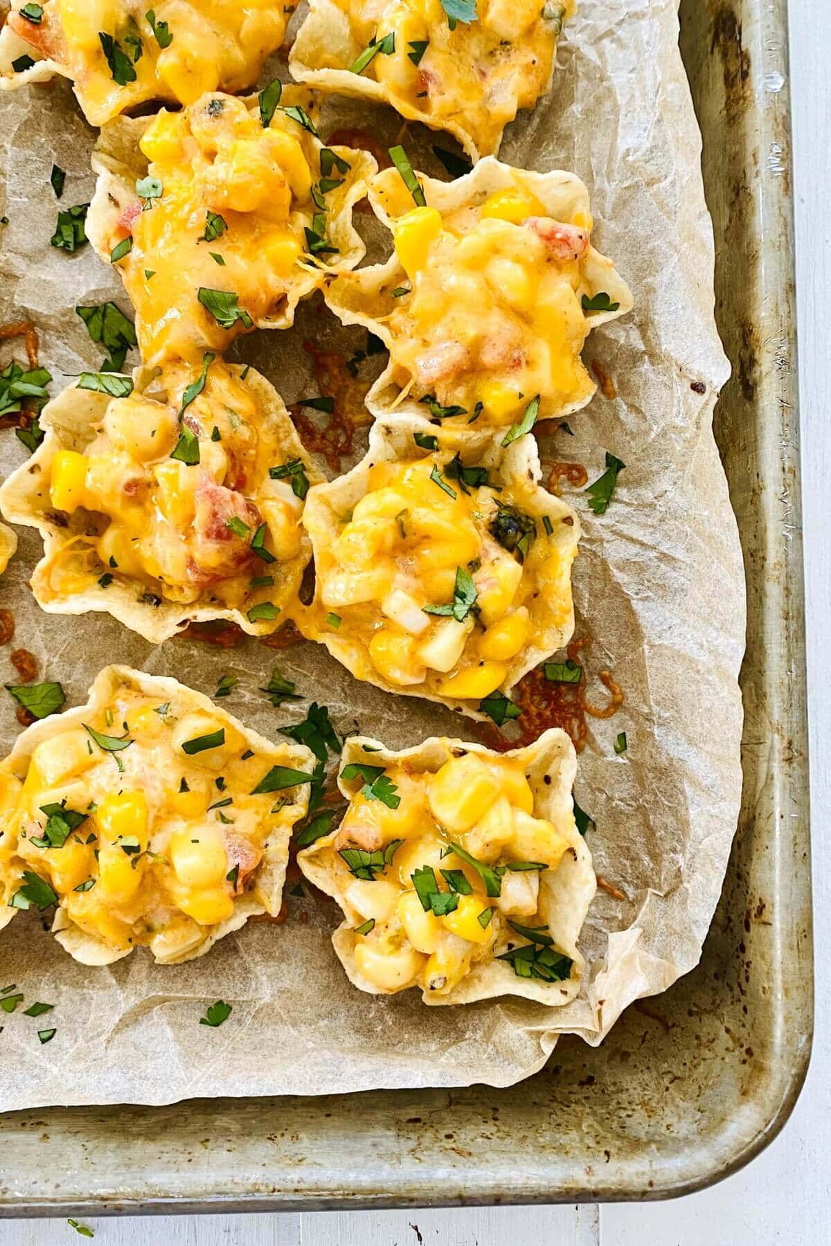 Tostito Scoops filled with hot corn dip.